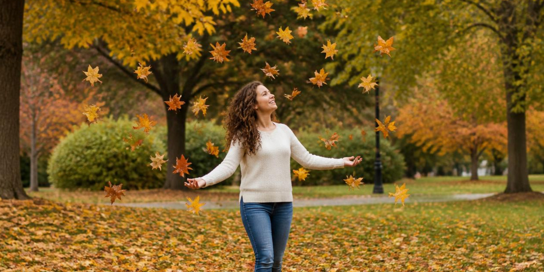 A woman walking in the leaves with defined curls styled for fall humidity and frizz control
